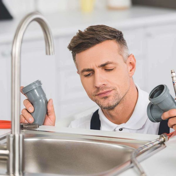 thoughtful-adult-repairman-holding-pipes-and-tools-resize.jpg thoughtful-adult-repairman-holding-pipes-and-tools-resize.jpg